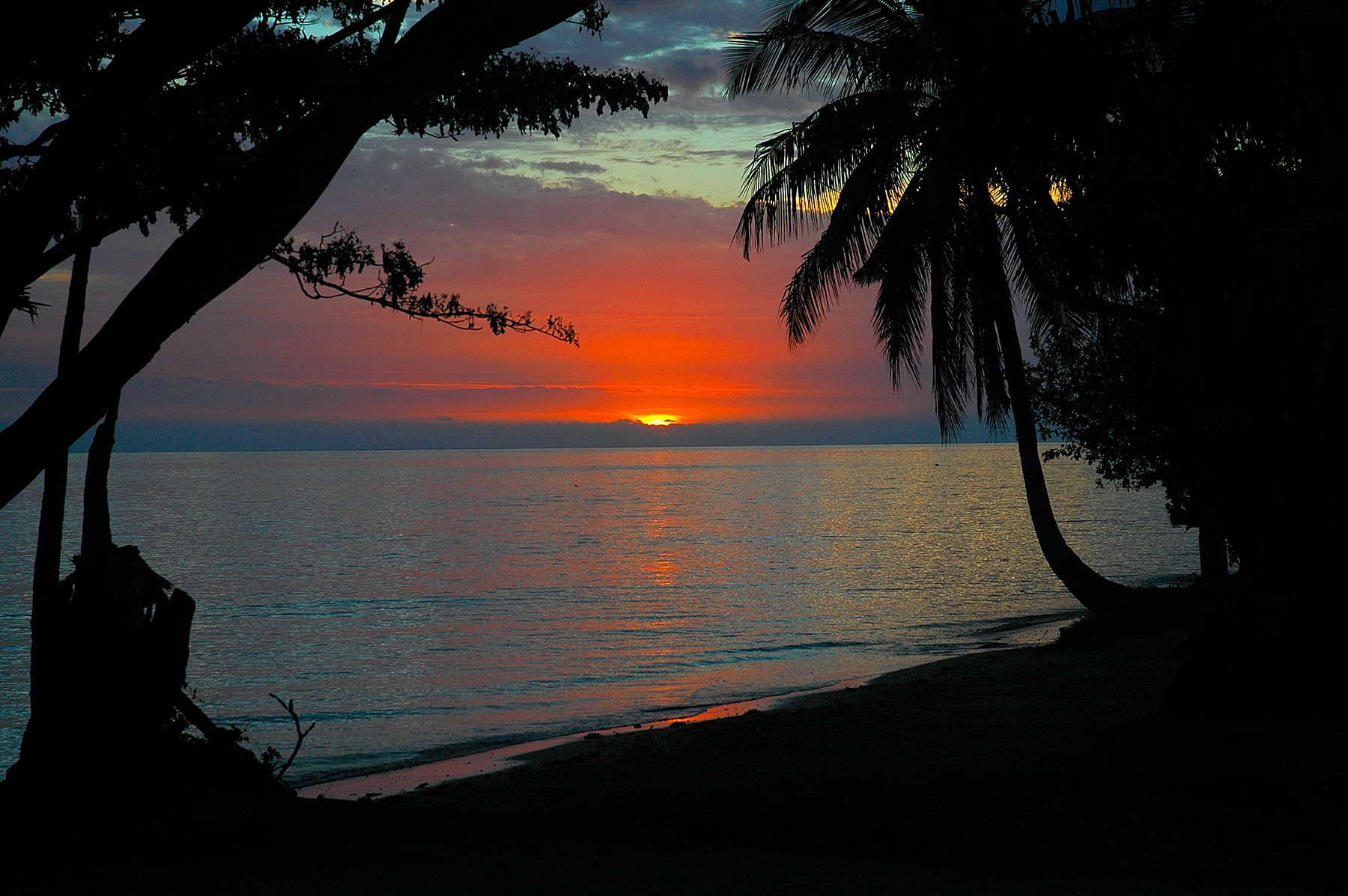 Sunset on beach below the Malolo Island subdivision